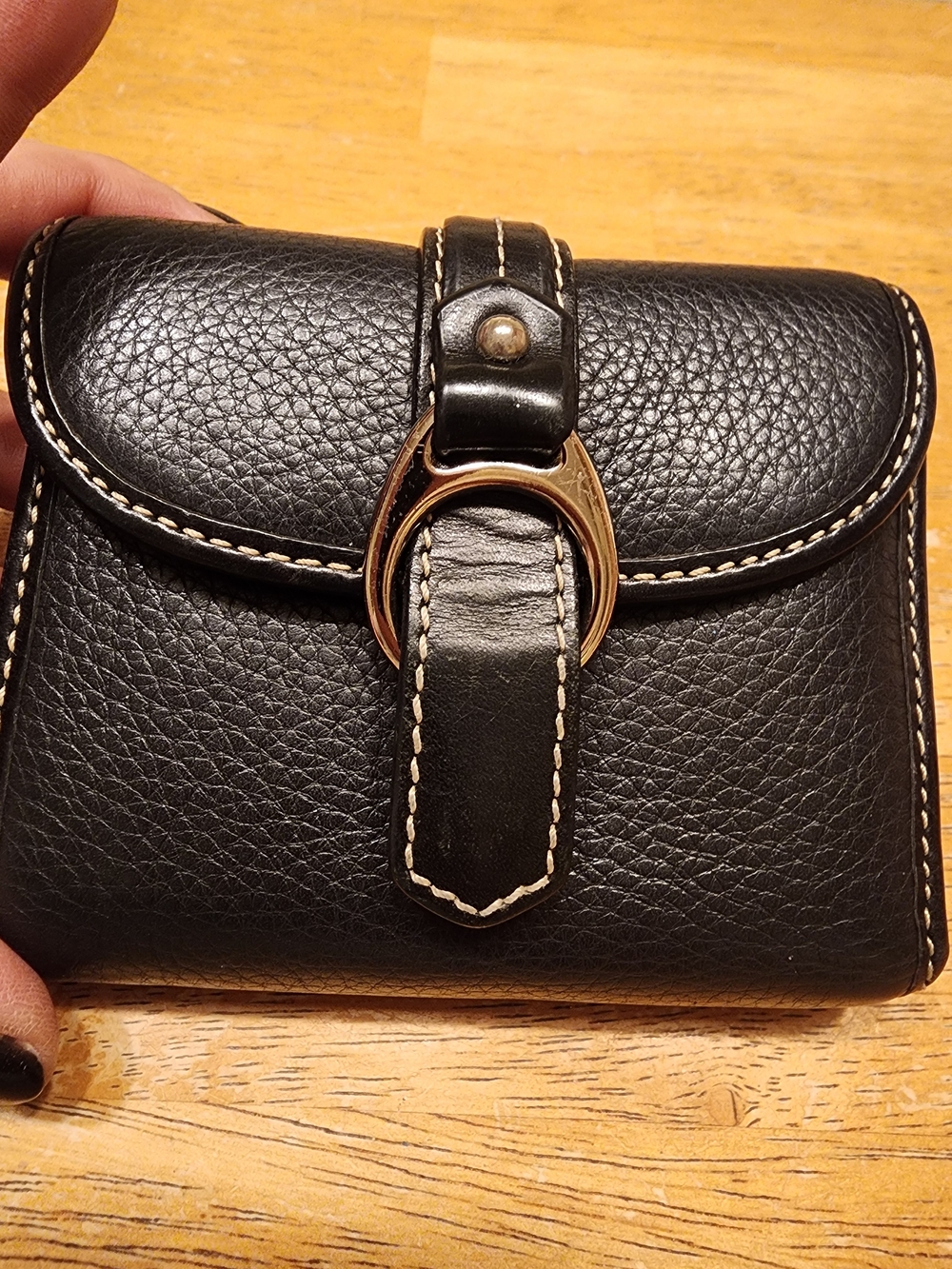 vintage bifold compact wallet is from Dooney & Bourke's Pebble Grain collection.